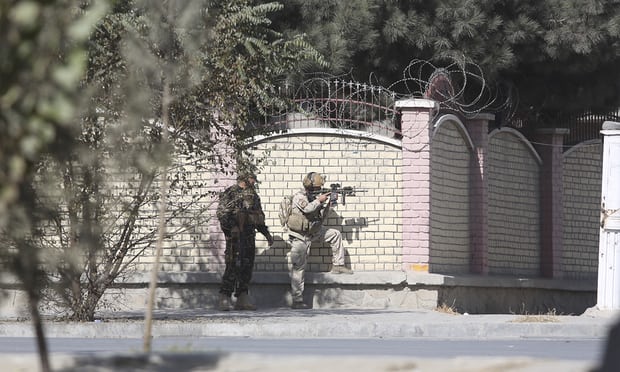  Afghan security personnel take up a position near the Shamshad TV compound. Photograph: Rahmat Gul/AP 